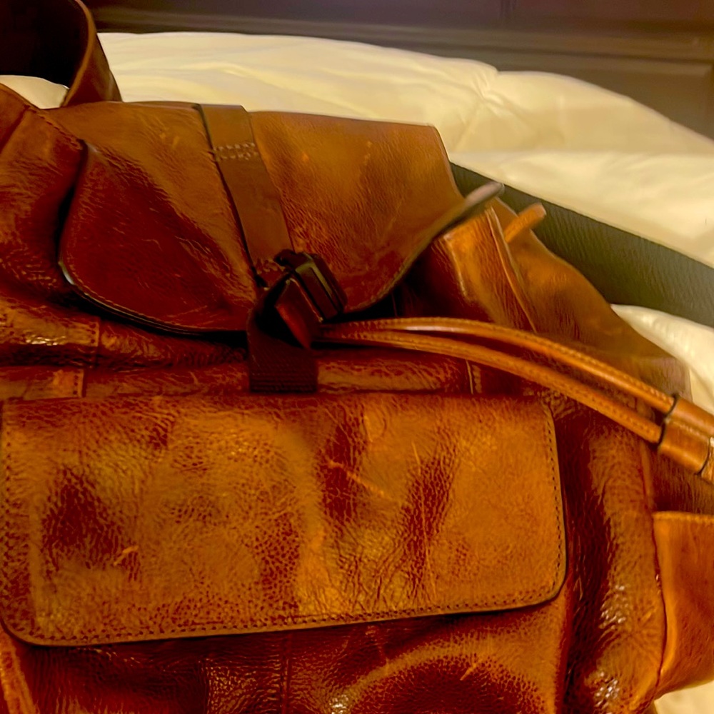 This is a fossil backpack rich brown leather real leather